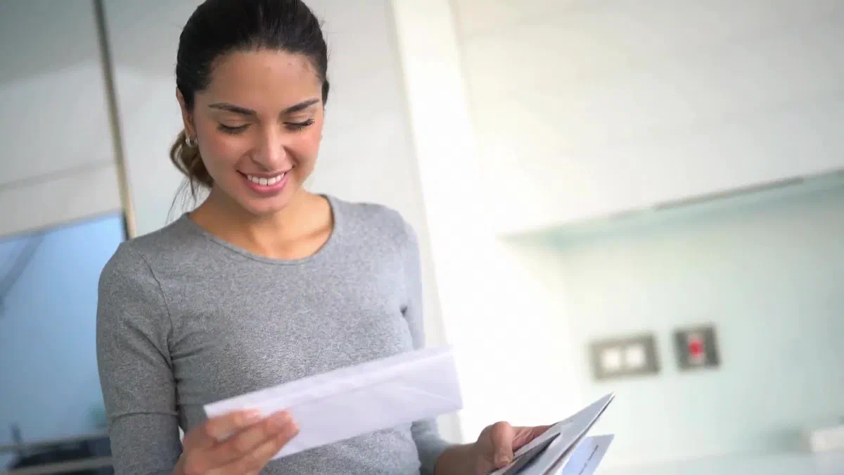 Person reading important mail at home